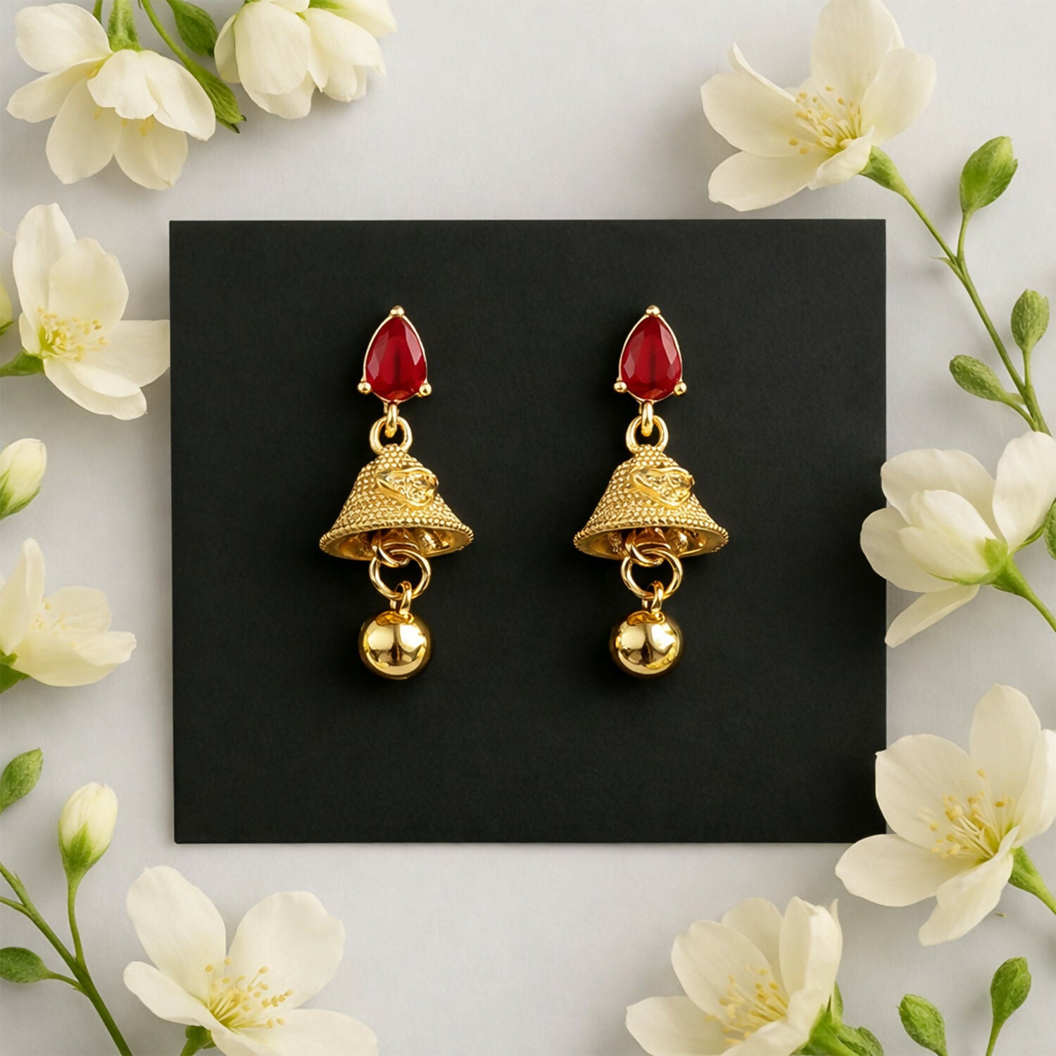 Exquisite Ruby Teardrop Jhumka Earrings with Textured Gold Bell Accents - Detailed Feature View 2