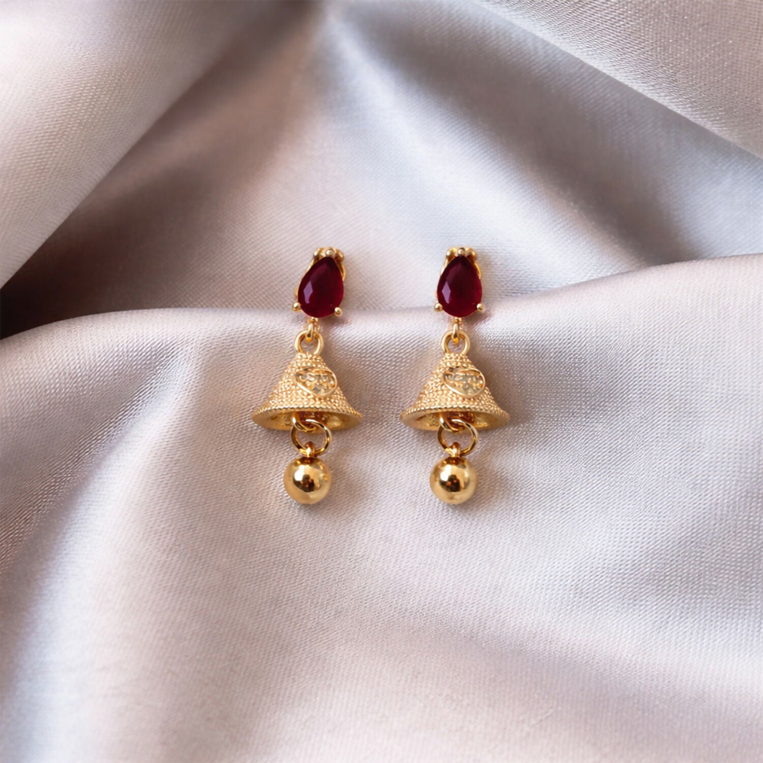 Exquisite Ruby Teardrop Jhumka Earrings with Textured Gold Bell Accents - Detailed Feature View 3