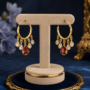 Premium Golden-Plated Twisted Hoop Bali Earrings with Crimson Ruby & Clear Crystal Teardrop Fringe - Buy Online at Alikart