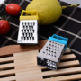 Premium Mini Grater with Magnet Holder – Stainless Steel Multifunctional Handheld Cheese, Garlic, Ginger & Vegetable Slicer with Spoon(Random color-Pack of 1) - Buy Online at Alikart
