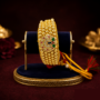 Premium Royal Rajasthani Golden Bead Poochi Wristband with Peacock Meenakari Round Medallion - Buy Online at Alikart